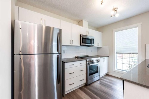 428 Cranbrook Square Se, Calgary, AB - Indoor Photo Showing Kitchen With Stainless Steel Kitchen