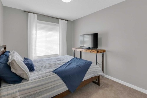 216 Sundown Road, Cochrane, AB - Indoor Photo Showing Bedroom