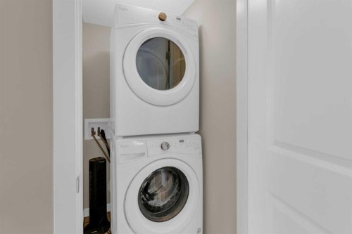 216 Sundown Road, Cochrane, AB - Indoor Photo Showing Laundry Room