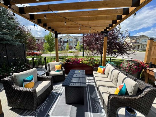 216 Sundown Road, Cochrane, AB - Outdoor With Deck Patio Veranda With Exterior