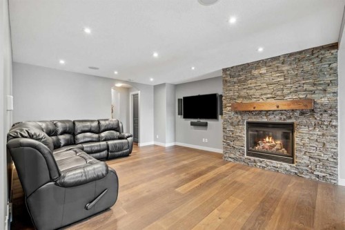 88 Crestridge Way Sw, Calgary, AB - Indoor Photo Showing Living Room With Fireplace