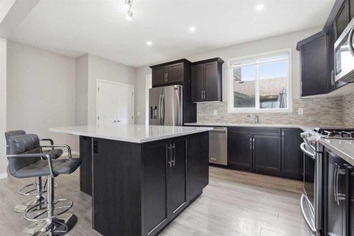 312 Carrington Way Nw, Calgary, AB - Indoor Photo Showing Kitchen With Stainless Steel Kitchen With Upgraded Kitchen