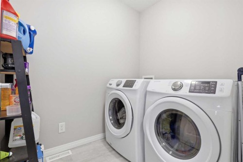 312 Carrington Way Nw, Calgary, AB - Indoor Photo Showing Laundry Room