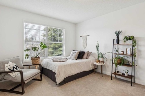 94 West Springs Way Sw, Calgary, AB - Indoor Photo Showing Bedroom