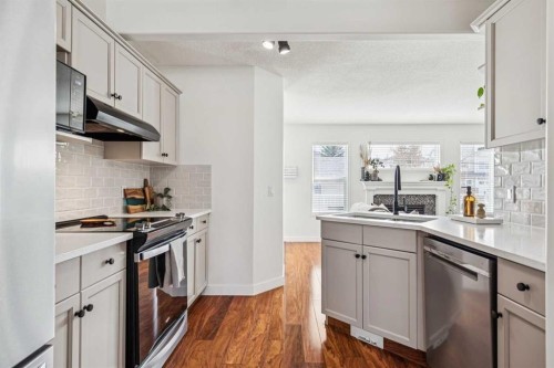 94 West Springs Way Sw, Calgary, AB - Indoor Photo Showing Kitchen With Stainless Steel Kitchen With Upgraded Kitchen