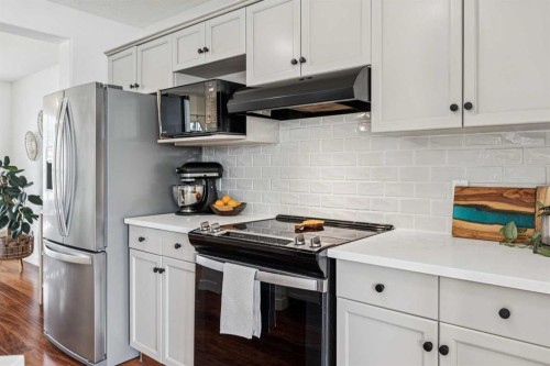 94 West Springs Way Sw, Calgary, AB - Indoor Photo Showing Kitchen With Stainless Steel Kitchen With Upgraded Kitchen