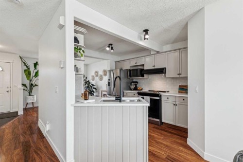 94 West Springs Way Sw, Calgary, AB - Indoor Photo Showing Kitchen With Stainless Steel Kitchen