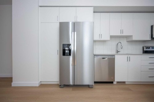302-8535 19 Avenue Se, Calgary, AB - Indoor Photo Showing Kitchen With Stainless Steel Kitchen