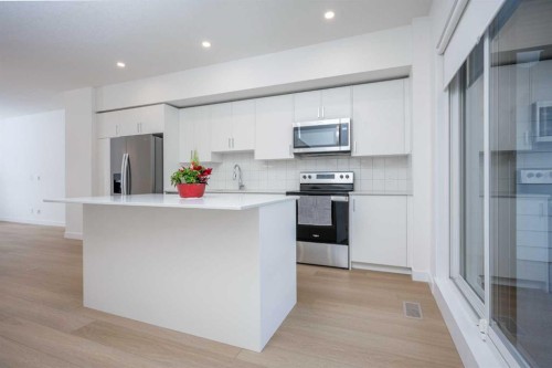 302-8535 19 Avenue Se, Calgary, AB - Indoor Photo Showing Kitchen With Stainless Steel Kitchen With Upgraded Kitchen