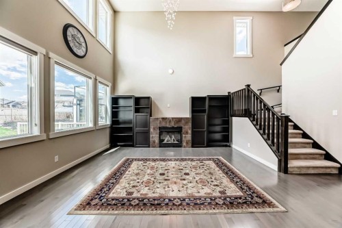 210 Stonemere Green, Chestermere, AB - Indoor Photo Showing Other Room With Fireplace