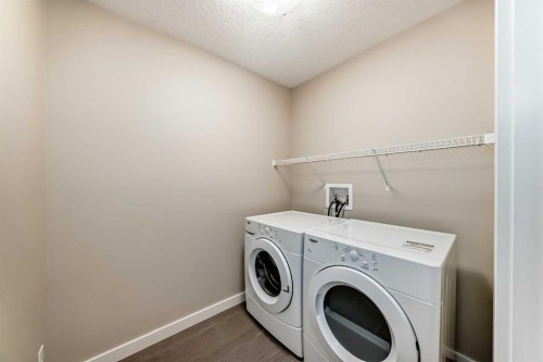 210 Stonemere Green, Chestermere, AB - Indoor Photo Showing Laundry Room