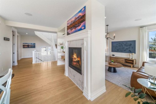 103 Brome Bend, Rural Rocky View County, AB - Indoor Photo Showing Living Room With Fireplace