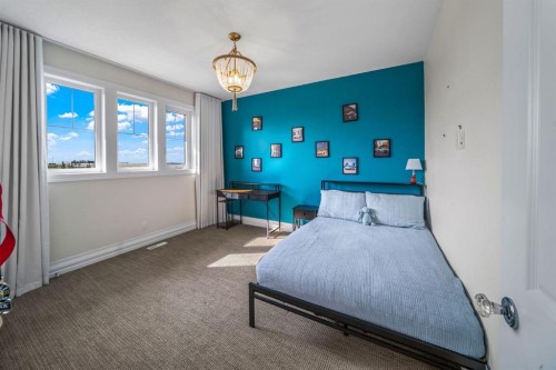 103 Brome Bend, Rural Rocky View County, AB - Indoor Photo Showing Bedroom