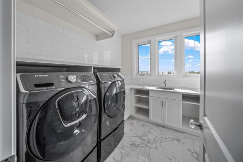103 Brome Bend, Rural Rocky View County, AB - Indoor Photo Showing Laundry Room