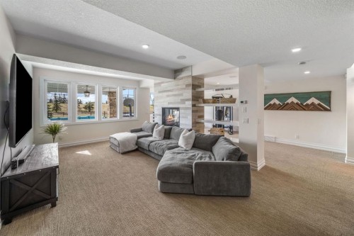 103 Brome Bend, Rural Rocky View County, AB - Indoor With Fireplace