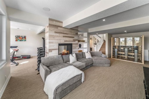103 Brome Bend, Rural Rocky View County, AB - Indoor Photo Showing Living Room With Fireplace