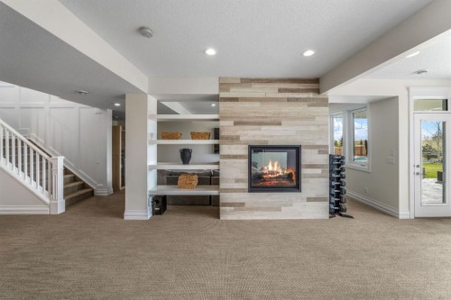 103 Brome Bend, Rural Rocky View County, AB - Indoor With Fireplace