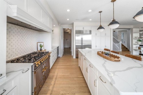 103 Brome Bend, Rural Rocky View County, AB - Indoor Photo Showing Kitchen With Upgraded Kitchen