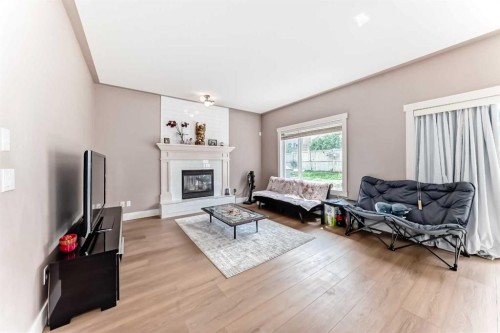 57 Sherwood Terrace Nw, Calgary, AB - Indoor Photo Showing Living Room With Fireplace