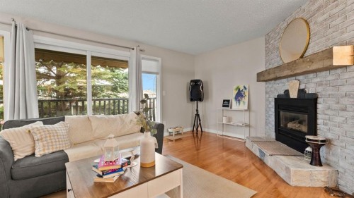 2416 Woodview Drive Sw, Calgary, AB - Indoor Photo Showing Living Room With Fireplace