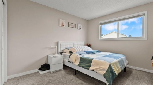 2416 Woodview Drive Sw, Calgary, AB - Indoor Photo Showing Bedroom