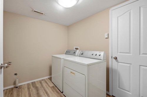 64 Isbister Close, Red Deer, AB - Indoor Photo Showing Laundry Room