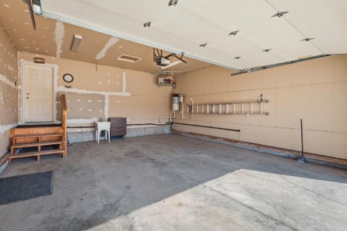 64 Isbister Close, Red Deer, AB - Indoor Photo Showing Garage