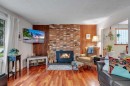 4623 31 Avenue Ne, Calgary, AB  - Indoor Photo Showing Living Room With Fireplace 