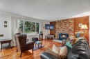 4623 31 Avenue Ne, Calgary, AB  - Indoor Photo Showing Living Room With Fireplace 