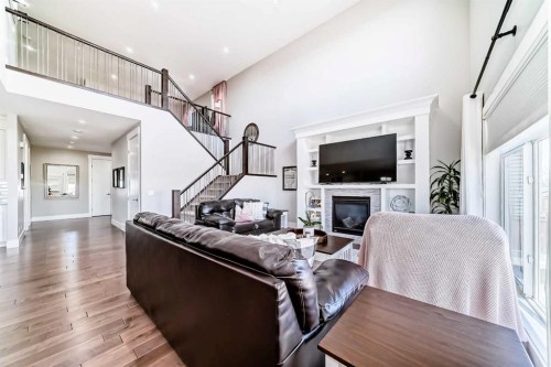 114 Kinniburgh Road, Chestermere, AB - Indoor Photo Showing Other Room With Fireplace