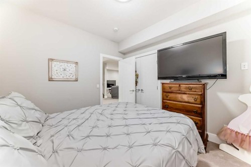 114 Kinniburgh Road, Chestermere, AB - Indoor Photo Showing Bedroom