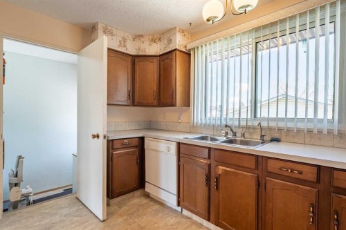 3320 Temple Road Ne, Calgary, AB - Indoor Photo Showing Kitchen With Double Sink