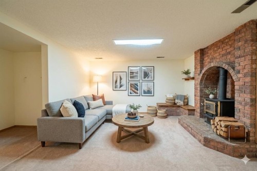 3320 Temple Road Ne, Calgary, AB - Indoor Photo Showing Living Room With Fireplace