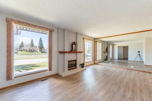 3320 Temple Road Ne, Calgary, AB - Indoor Photo Showing Living Room With Fireplace