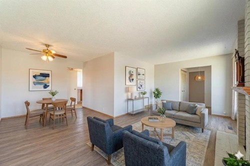 3320 Temple Road Ne, Calgary, AB - Indoor Photo Showing Living Room With Fireplace