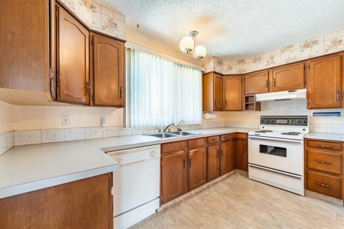 3320 Temple Road Ne, Calgary, AB - Indoor Photo Showing Kitchen With Double Sink