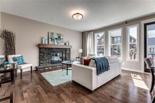 19 Aspen Acres Road Sw, Calgary, AB - Indoor Photo Showing Living Room With Fireplace
