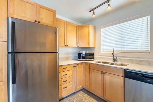 143 Erin Mount Place Se, Calgary, AB - Indoor Photo Showing Kitchen With Double Sink