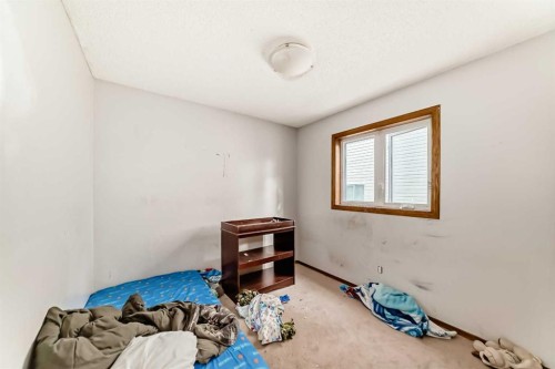 176 Woodside Road Nw, Airdrie, AB - Indoor Photo Showing Bedroom