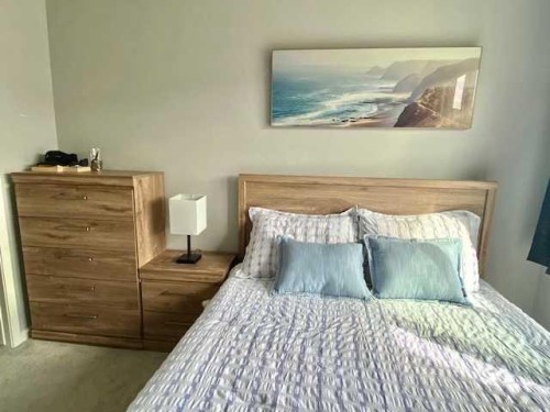 217-4350 Seton Drive Se, Calgary, AB - Indoor Photo Showing Bedroom