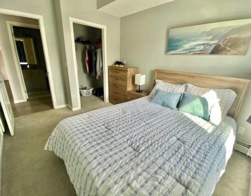217-4350 Seton Drive Se, Calgary, AB - Indoor Photo Showing Bedroom