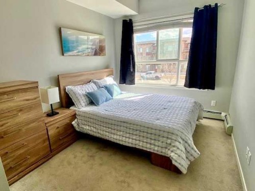 217-4350 Seton Drive Se, Calgary, AB - Indoor Photo Showing Bedroom