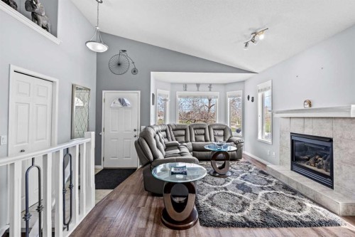 187 West Lakeview Circle, Chestermere, AB - Indoor Photo Showing Living Room With Fireplace