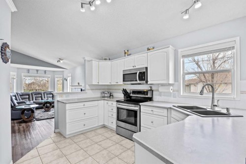 187 West Lakeview Circle, Chestermere, AB - Indoor Photo Showing Kitchen With Stainless Steel Kitchen With Double Sink