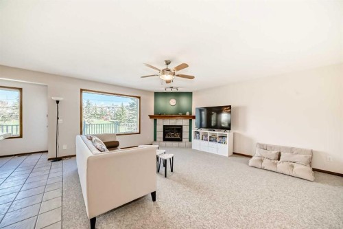 135 Panorama Hills Manor Nw, Calgary, AB - Indoor Photo Showing Living Room With Fireplace
