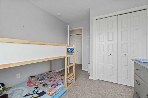 52 Saddlestone Drive Ne, Calgary, AB - Indoor Photo Showing Bedroom