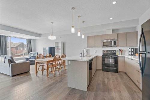 52 Saddlestone Drive Ne, Calgary, AB - Indoor Photo Showing Kitchen With Double Sink With Upgraded Kitchen