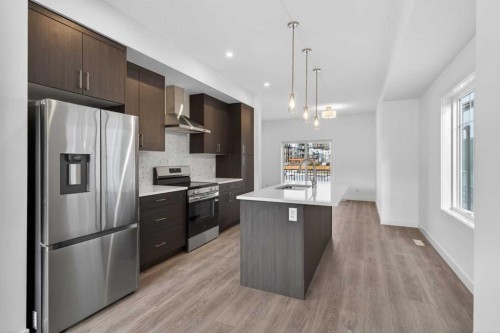 140-2231 81St Street Sw, Calgary, AB - Indoor Photo Showing Kitchen With Stainless Steel Kitchen With Upgraded Kitchen