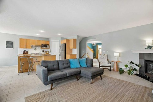 90 Elgin Drive Se, Calgary, AB - Indoor Photo Showing Living Room With Fireplace