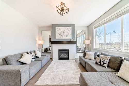312 Auburn Shores Way Se, Calgary, AB - Indoor Photo Showing Living Room With Fireplace